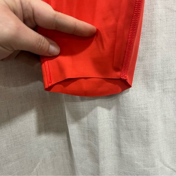 Athleta x Peloton Velocity 7/8 Orange Leggings with Zipper Pouch - Picture 7 of 11